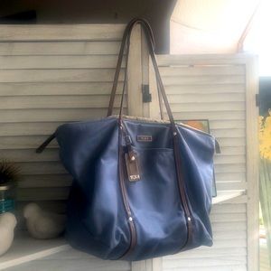 TUMI Denim colored nylon tote with tan leather